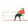 Woman sitting on bench.