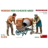 Workers with concrete mixer.